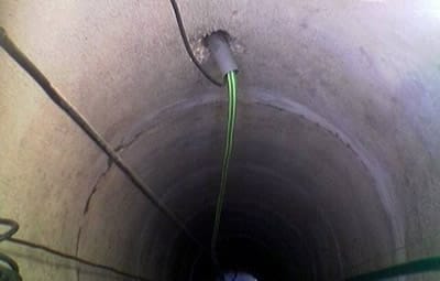 Прокладка трубы в колодец
