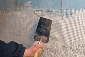 Процесс наклейки сетки на гипсокартон